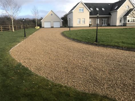 A gravel driveway is a type of driveway made from small, loose stones which are much easier to work with than asphalt or concrete. Despite these benefits, gravel driveways do have some drawbacks. For example, they need to be regularly graded and can be susceptible to washing out in heavy rains. 